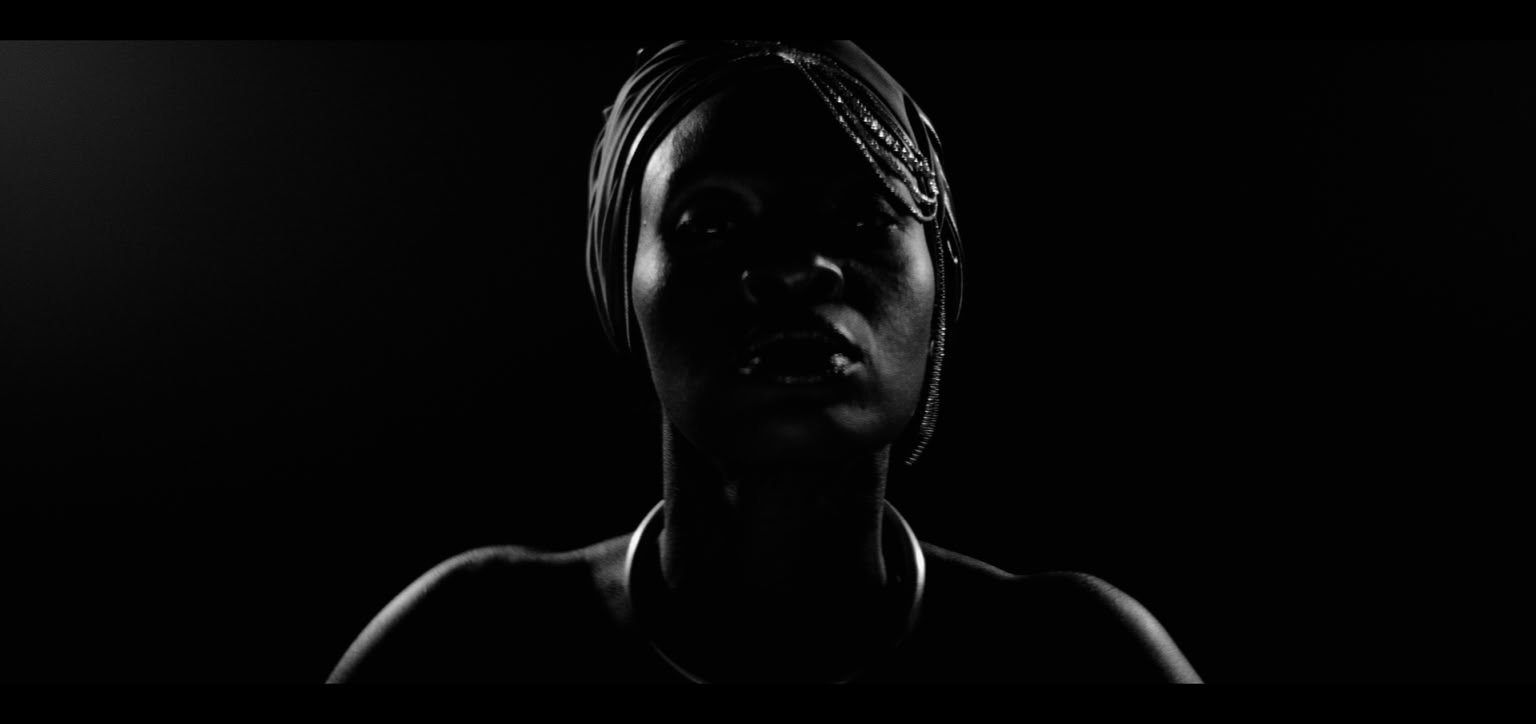 Silhouette of a person a dark background.